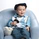 05 Easter Special: boy in hat blue chair with bunnies