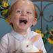 laughing baby portrait with easter bunny