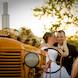 columbia missouri wedding photographer: groom and bride with tractor