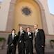 columbia missouri wedding photographer: groomsmen in front of church