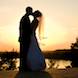 columbia missouri wedding photographer: kiss by bride groom in setting sun